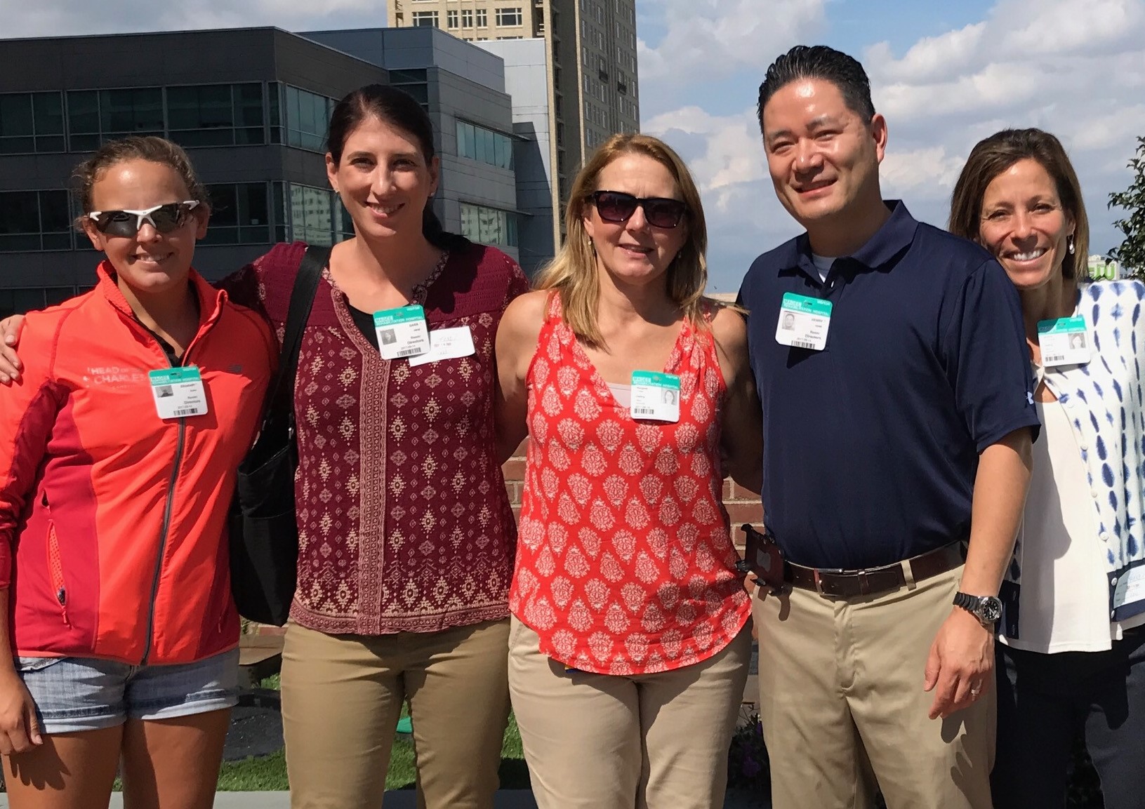 DoD team standing in front of a blue sky